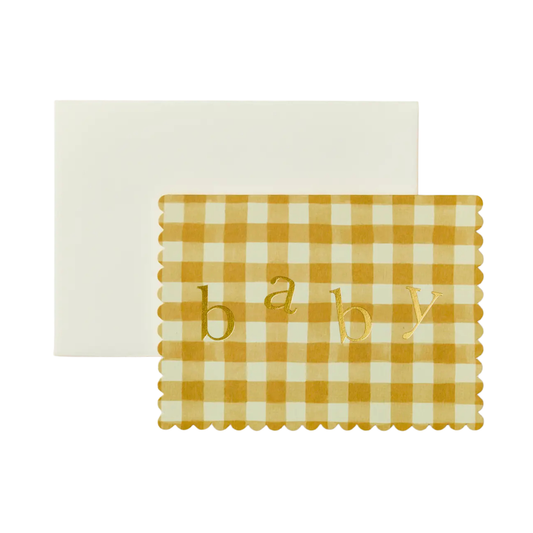 Yellow and white checkered placemat with 'baby' text on a white background